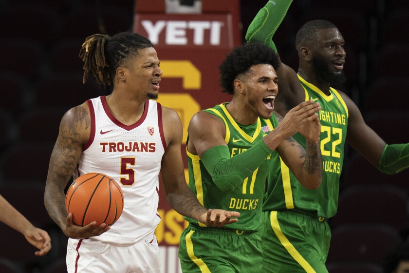 Oregon's Franck Kepnang (22) and Rivaldo Soares (11) react to a foul call on USC's Isaiah White (5) during the first half.