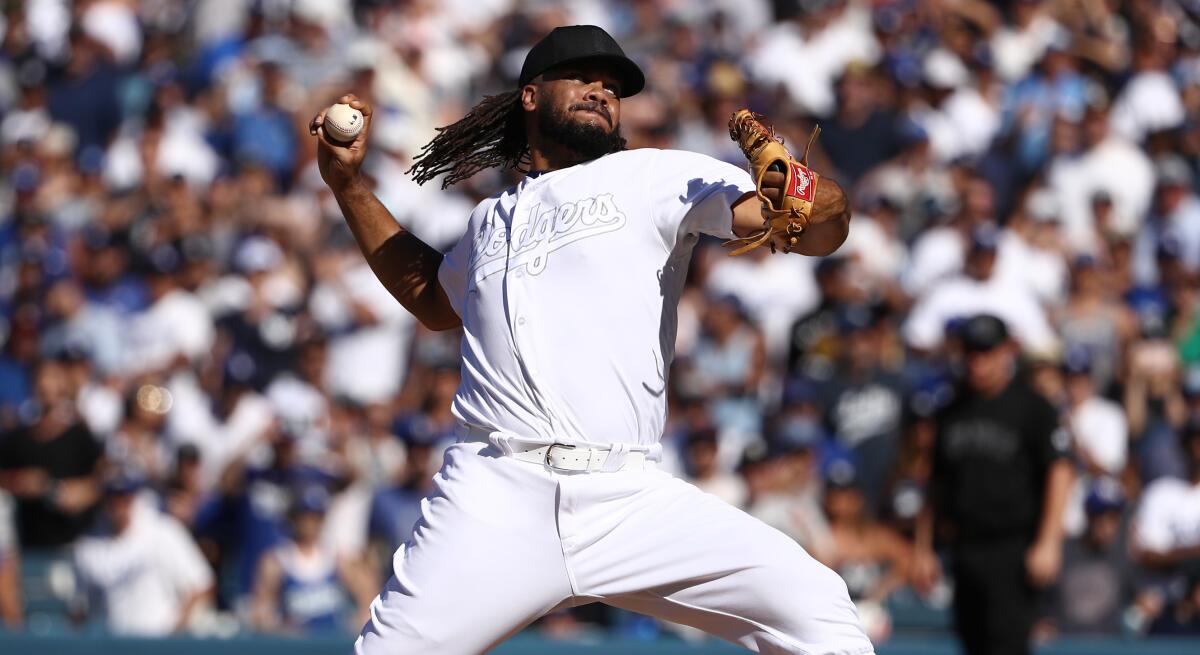 Dodgers pitcher Kenley Jansen pitches in the ninth inning against the New York Yankees at Dodger Stadium on Saturday.