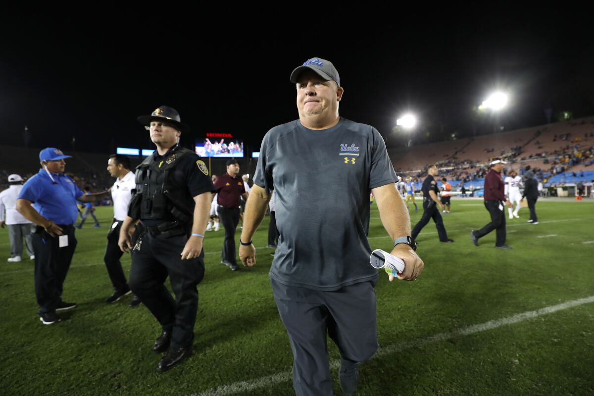UCLA coach Chip Kelly walks off the field after the win against Arizona State on Saturday at the Rose Bowl.