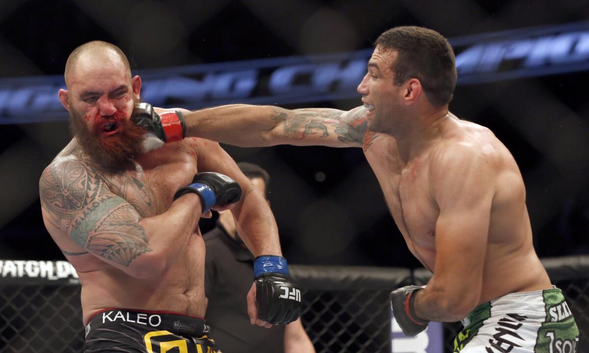 Fabricio Werdum, right, lands a right hand against Travis Browne during their UFC bout in April.