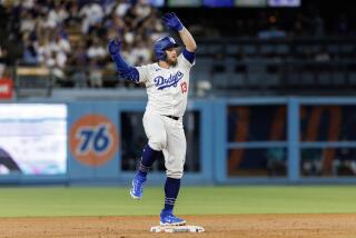 LOS ANGELS, CA - AUGUST 21, 2024: Los Angeles Dodgers third base Max Muncy (13) reacts.