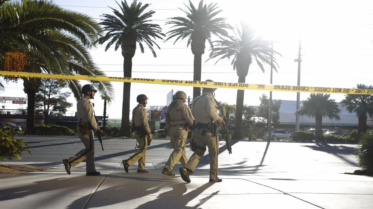 Authorities outside the Mandalay Bay hotel near the scene of the mass shooting Sunday at the Route 91 Harvest festival on Las Vegas Boulevard.
