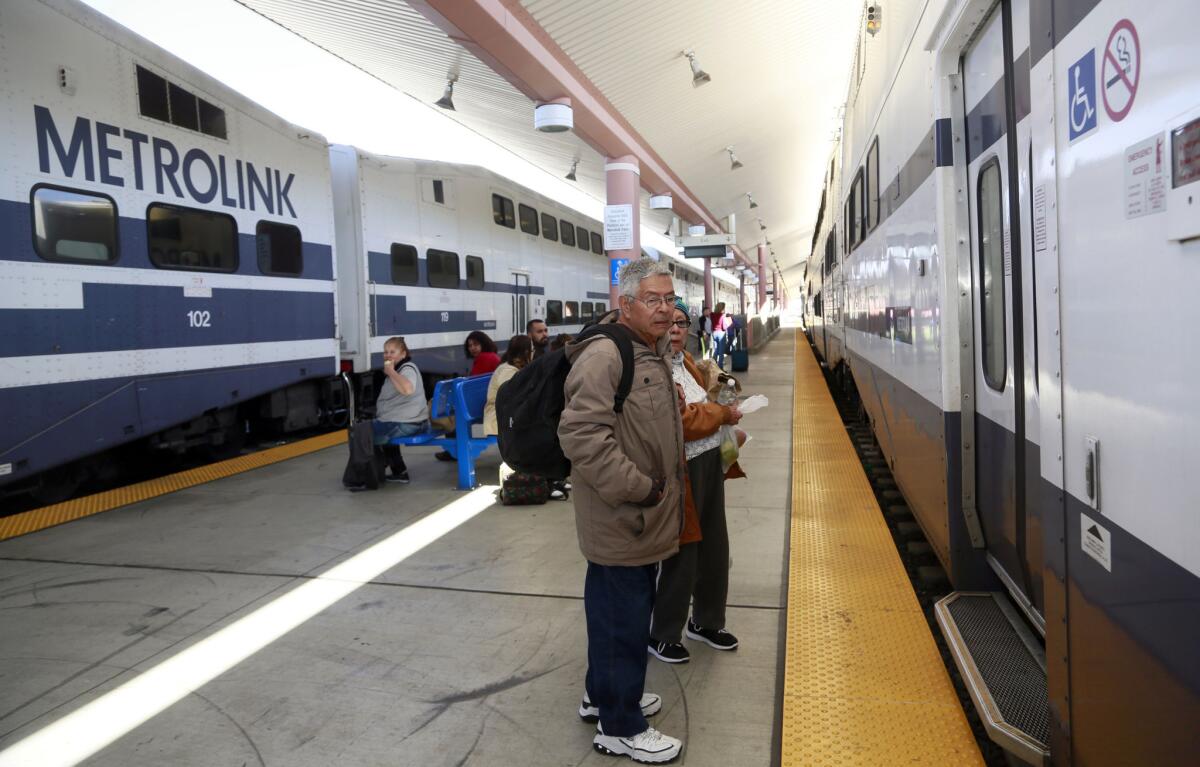 Passengers wait to board a Metrolink train at Union Station in downtown Los Angeles. A new safety measure is being expanded on the commuter system.