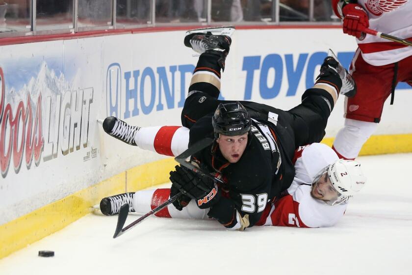 Ducks forward Matt Beleskey falls over Detroit Red Wings defenseman Brendan Smith during Game 5 of the Western Conference quarterfinals in May. Beleskey will be returning to the Ducks for the 2013-14 season.