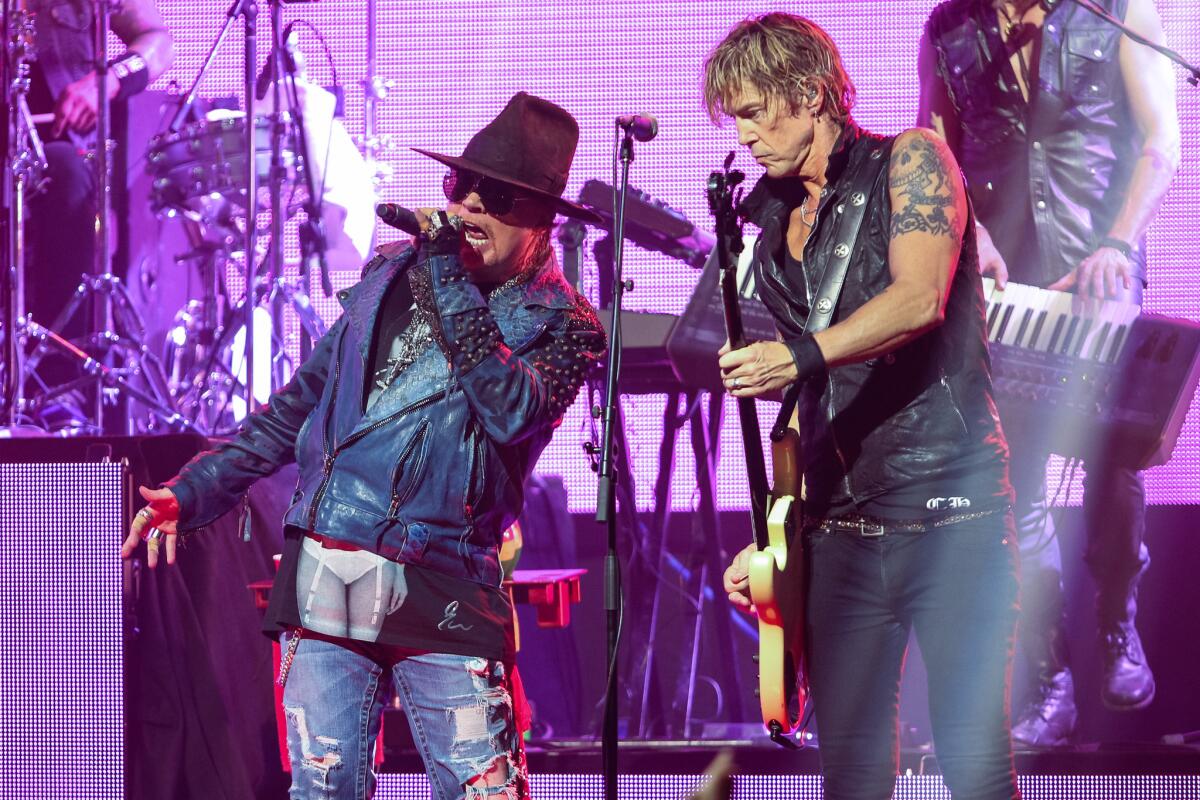 Axl Rose, left, and Duff McKagan of Guns N' Roses perform at a Los Angeles concert in 2014.