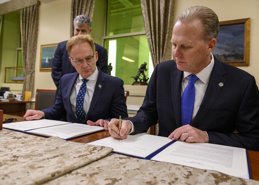 San Diego Mayor Kevin Faulconer signs the Navy Old Town Campus Revitalization Agreement alongside acting Navy Secretary Thomas Modly at the Pentagon on Thursday.