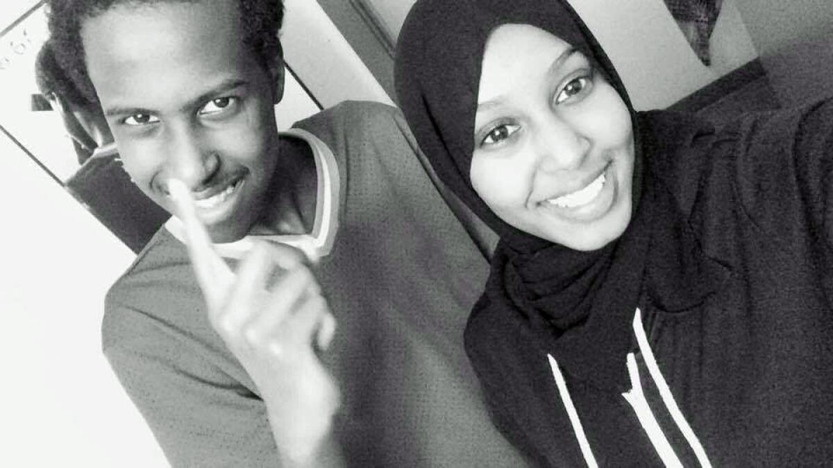 Seattle student Hamza Warsame, 16, left, with his sister, Ifrah Warsame, in 2015.