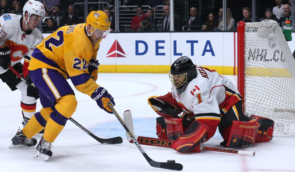 Trevor Lewis (22) and the Kings will take on goalie Jonas Hiller, a familiar foe from his days with the Ducks, and the Flames in a must-win situation Wednesday night in Calgary.