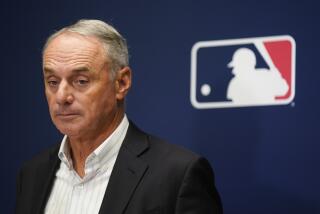 Major League Baseball Commissioner Rob Manfred speaks to reporters following an owners' meeting in New York