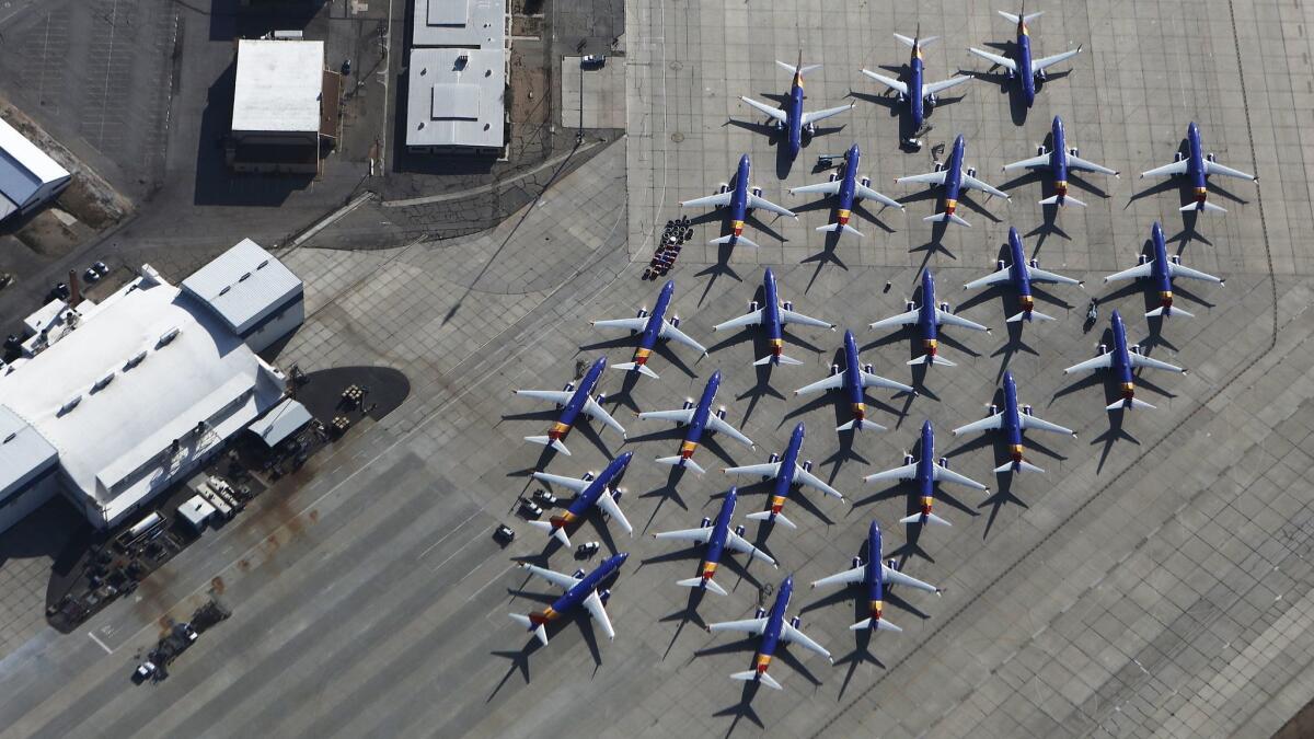 Boeing 737 Max planes sit, grounded