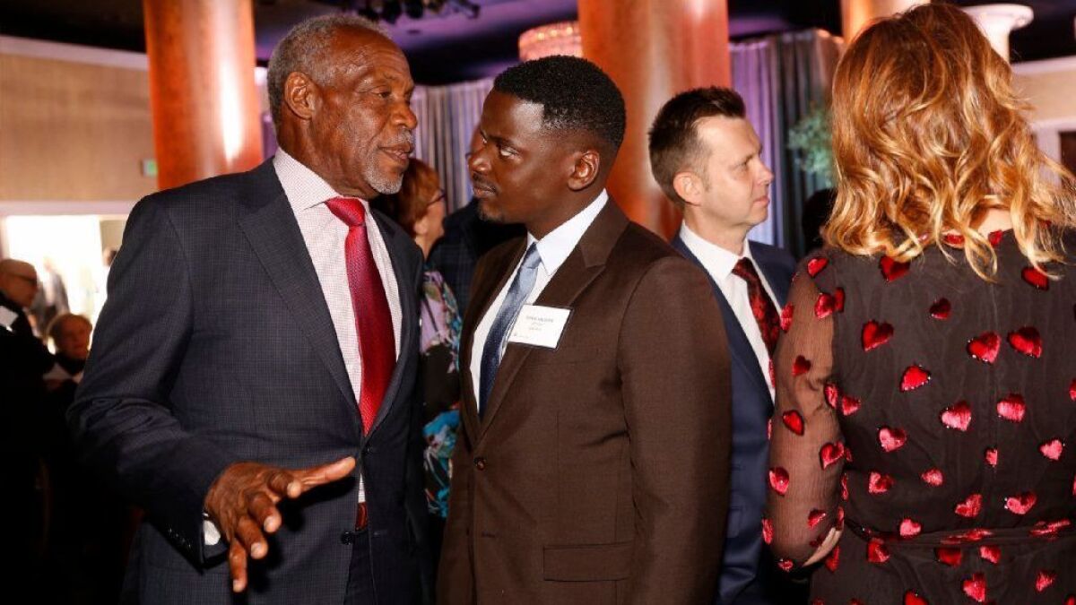 Danny Glover, left, talks with Daniel Kaluuya, right, nominated for Best Actor during the Nominees Luncheon for the 90th Oscars in the Beverly Hilton Grand Ballroom on Monday February 5, 2018.