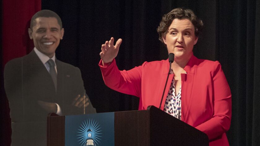 UC Irvine law professor Katie Porter, who is challenging Republican Rep. Mimi Walters in Orange County's 45th Congressional District, speaks to the Laguna Woods Democratic Club.