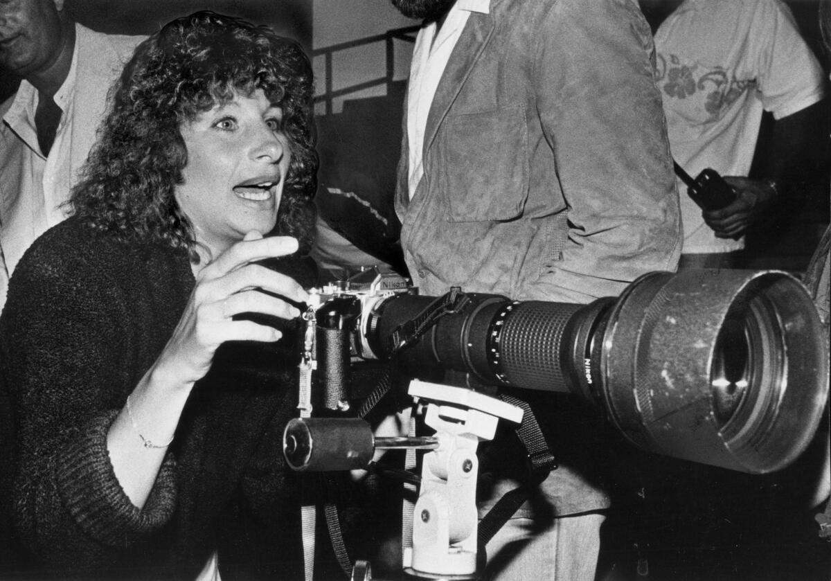 July 7, 1979: Actress Barbra Streisand borrows a telephoto lens for a close-up of the stage.