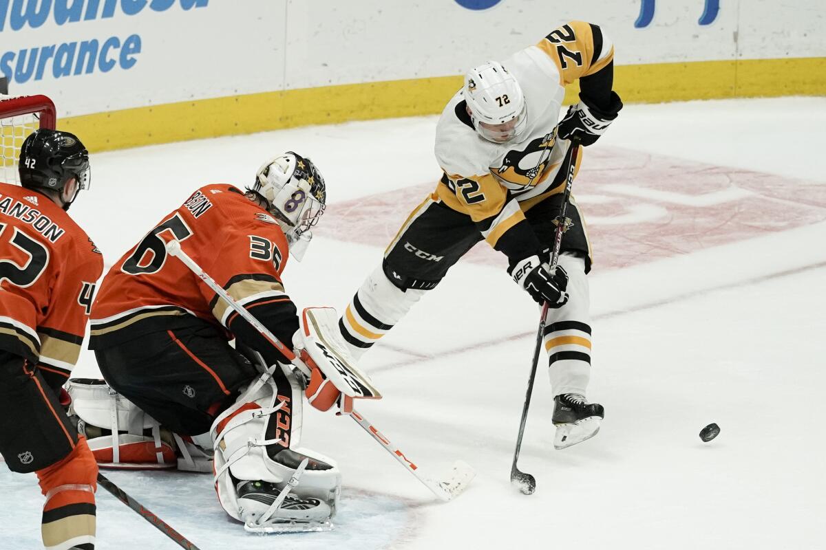 Ducks goalie John Gibson blocks a shot by Penguins wing Patric Hornqvist during the third period Friday night.