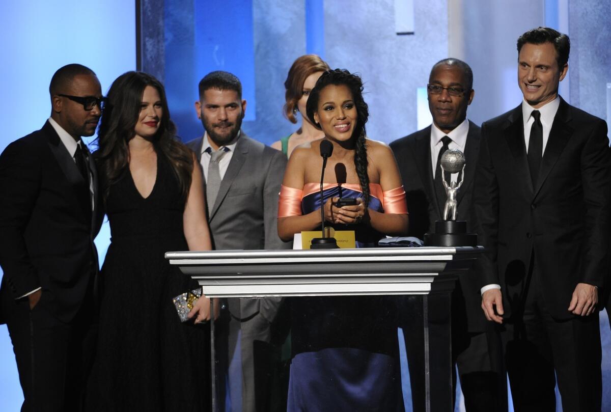 Columbus Short, left, Katie Lowes, Guillermo Díaz, Darby Stanchfield, Kerry Washington, Joe Morton and Tony Goldwyn accept the award for outstanding drama series for "Scandal" at the 45th NAACP Image Awards.