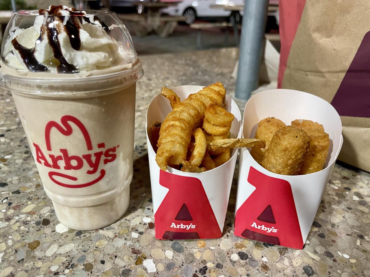 The Jamocha shake, small curly fries and four-piece mozzarella sticks from Arby's.