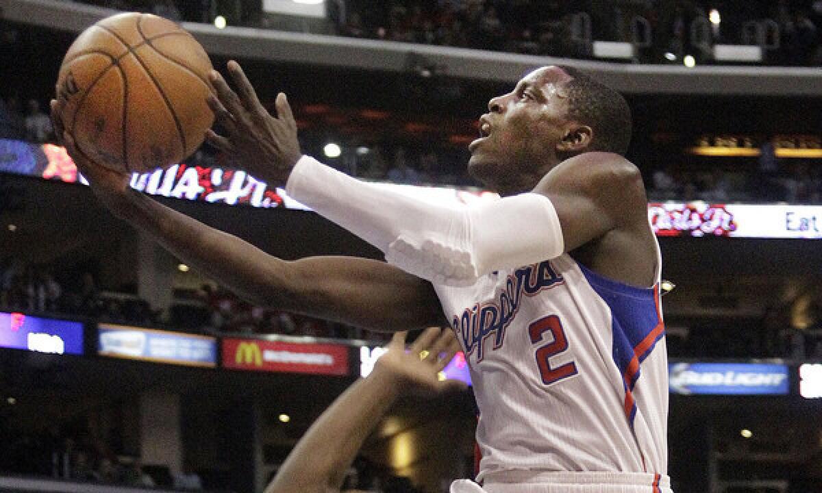 Clippers point guard Darren Collison scores a basket during the team's 111-105 win over the Boston Celtics on Wednesday at Staples Center.