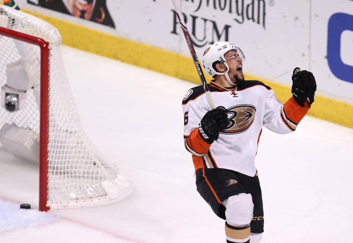 A 2015 photo from Game 4 of the Western Conference finals shows Emerson Etem celebrating a goal by Ducks teammate Kyle Palmieri against the Chicago Blackhawks.