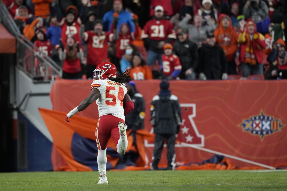 Kansas City Chiefs outside linebacker Nick Bolton (54) returns a fumble for a touchdown during the second half of an NFL football game against the Denver Broncos Saturday, Jan. 8, 2022, in Denver. (AP Photo/David Zalubowski)