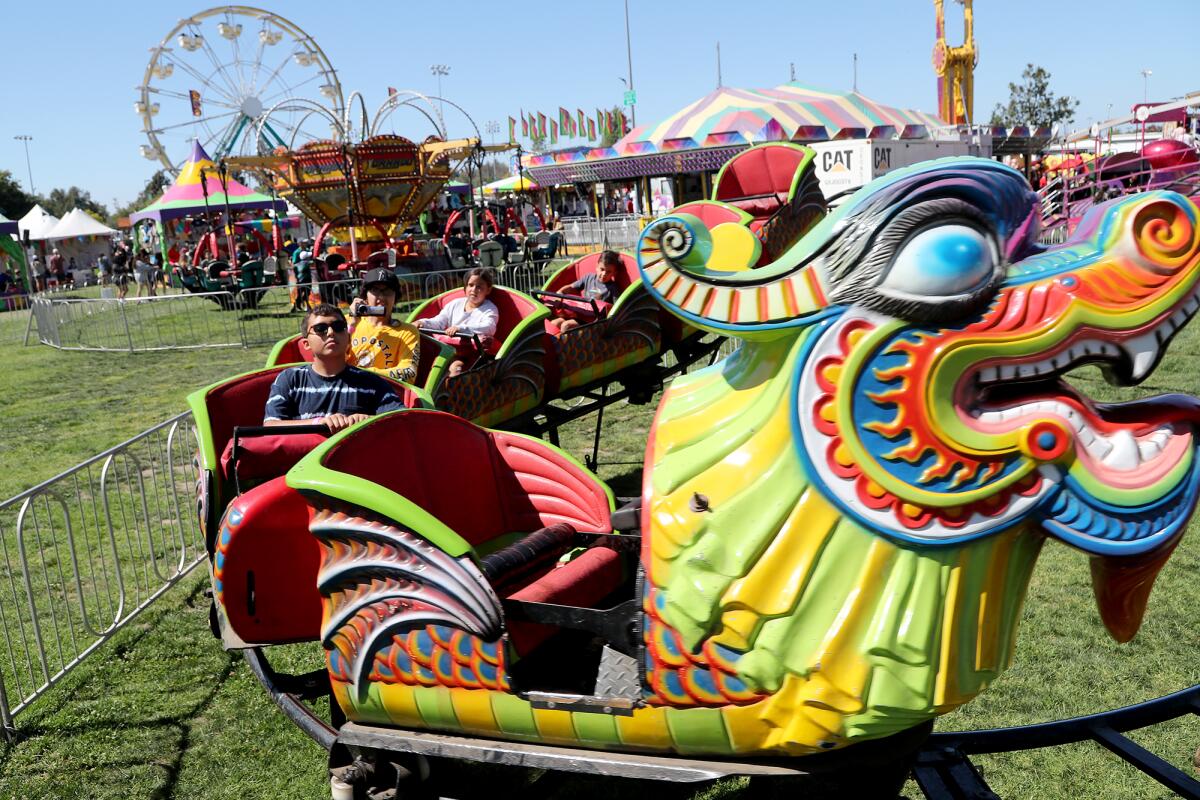 Festival-goers take a ride along the Orient Express during Summerfest at Fountain Valley Sports Park on Saturday.