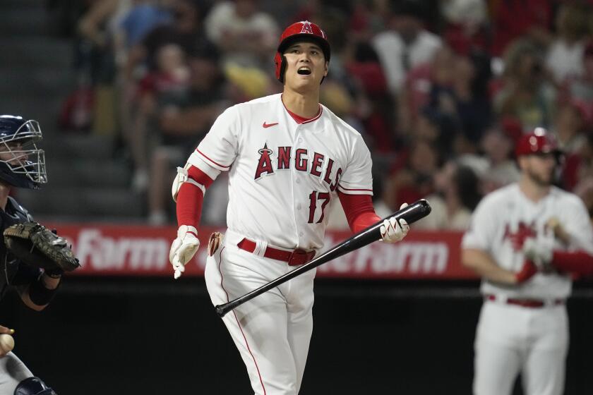 Los Angeles Angels designated hitter Shohei Ohtani (17) reacts after hitting a foul ball.