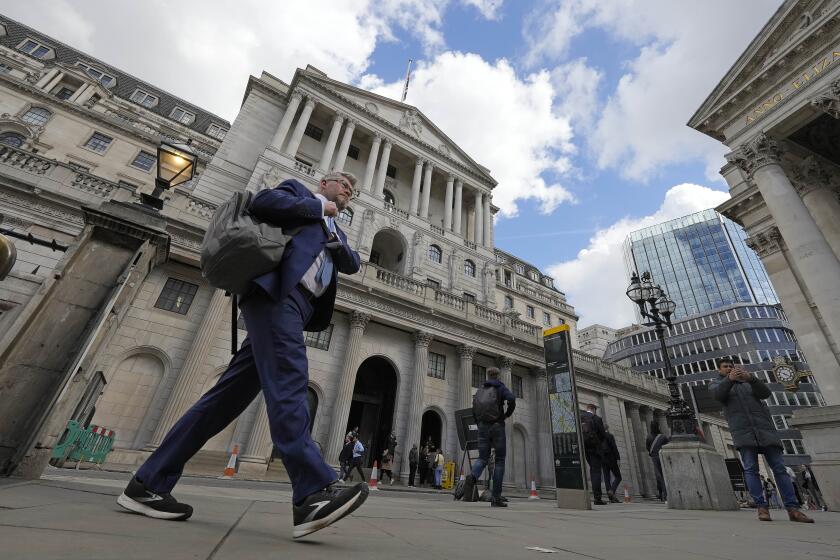 FILE - A man walks past the Bank of England, at the financial district in London, on May 11, 2023. Homeowners across the U.K. are hoping that the Bank of England will decide to avoid raising interest rates for the first time in nearly two years. Following news that inflation fell unexpectedly in August to its lowest level since Russia invaded Ukraine, expectations have grown that the central bank will opt Thursday, Sept. 21, 2023, to keep its main interest rate unchanged. (AP Photo/Frank Augstein)