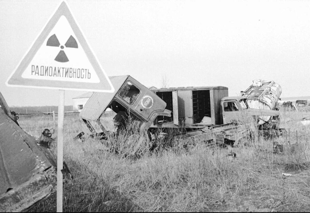Trucks polluted by radioactivity lie abandoned April 3, 1996, along the road to the Chernobyl nuclear plant. Tons of equipment used in the cleanup after the 1986 disaster remain in open and covered “graves” across the 30-kilometer (18-mile) zone around the station.