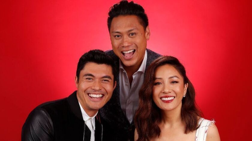 Jon M. Chu, center, director of the film "Crazy Rich Asians," is photographed with lead actors Henry Golding, left, and Constance Wu at the Beverly Wilshire hotel in Beverly Hills on Aug. 5, 2018.