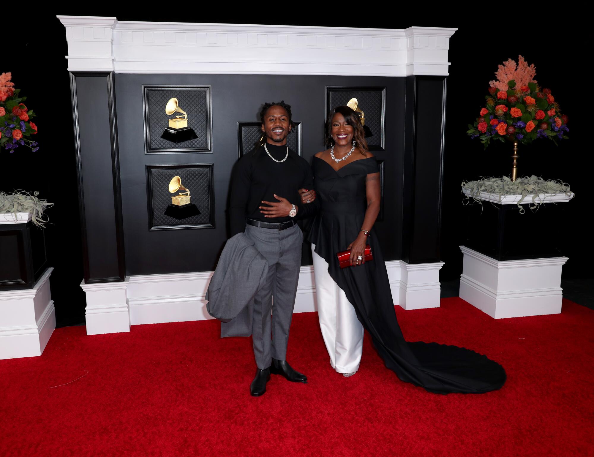 D Smoke and date on the red carpet at the 63rd Grammy Awards.