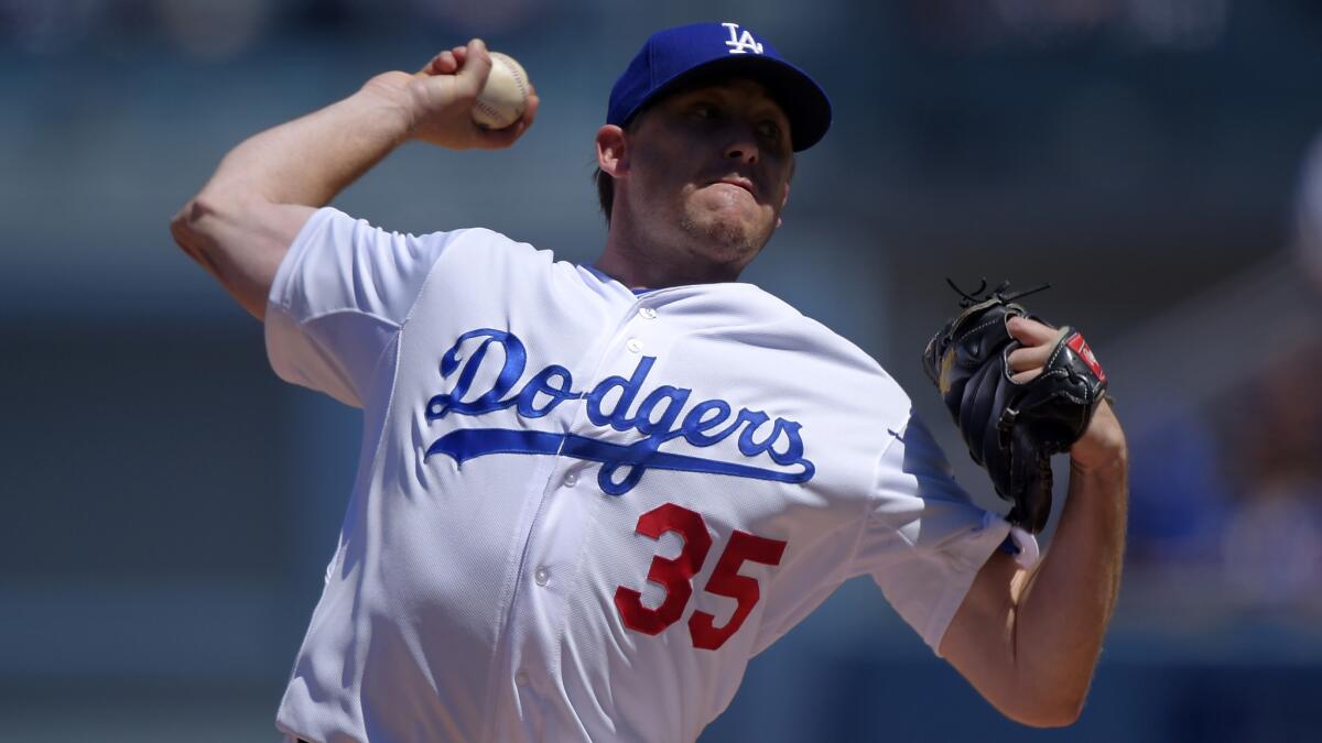 Dodgers starter Kevin Correia delivers a pitch during the first inning of an 11-3 loss to the New York Mets on Sunday.