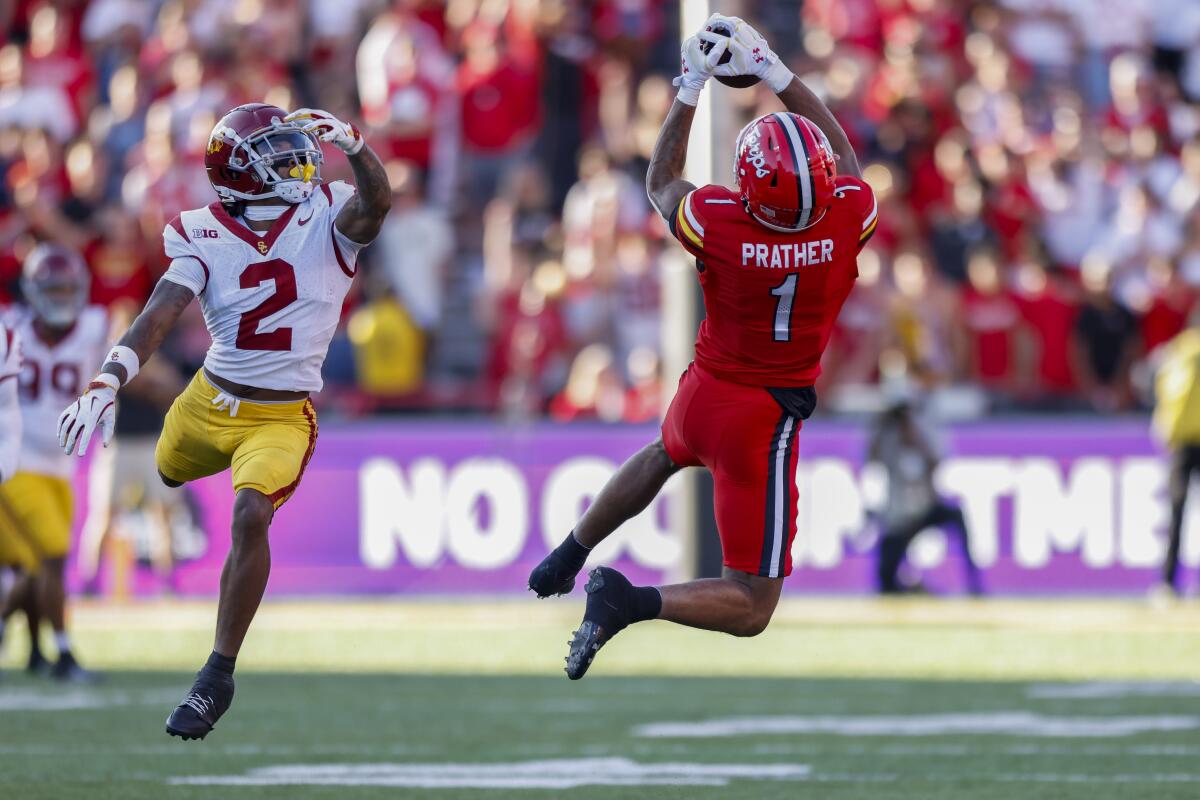 Maryland wide receiver Kaden Prather catches a pass in front of USC cornerback Jaylin Smith in the first half on Saturday.