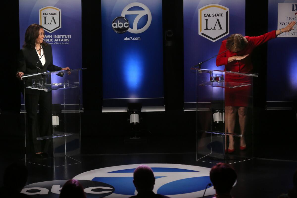 U.S. Senate candidate and California Attorney General Kamala Harris watches as her opponent Rep. Loretta Sanchez dabs at the end of her closing statement during their one and only debate at California State University, Los Angeles.