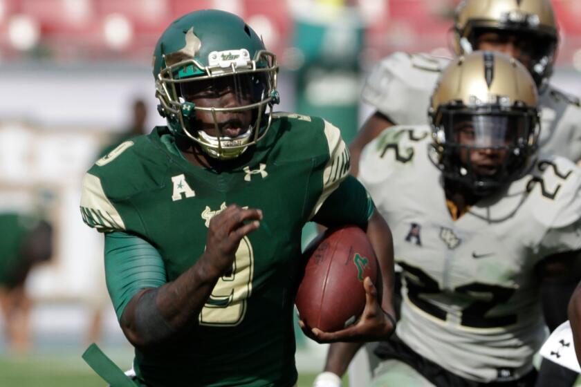 South Florida quarterback Quinton Flowers runs for a touchdown against Central Florida on Nov. 26.