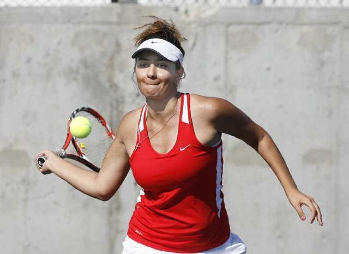 Glendale High's Veronika Galstyan moves in for a return against Hoover in a Pacific League rivalry match.