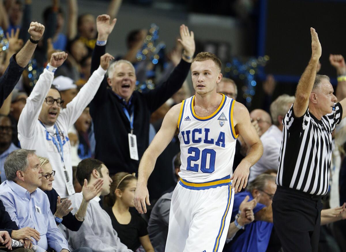 Bryce Alford soaks in the adulation from fans after hitting a three-pointer to end the first half against Arizona at Pauley Pavilion.