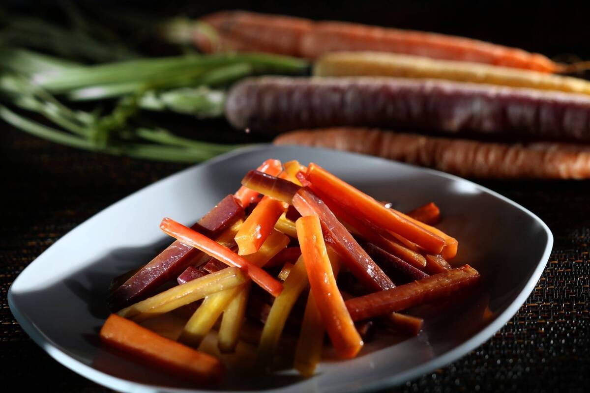 Carrots can be glazed with butter, serrano chile and shallots, then finished with orange juice and mint.