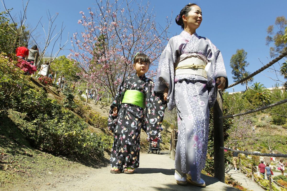Shiho Brenner and her daughter Midori Brenner wear traditional kimonos at the 10th annual Cherry Blossom Festival at the Japanese Friendship Garden in Balboa Park.