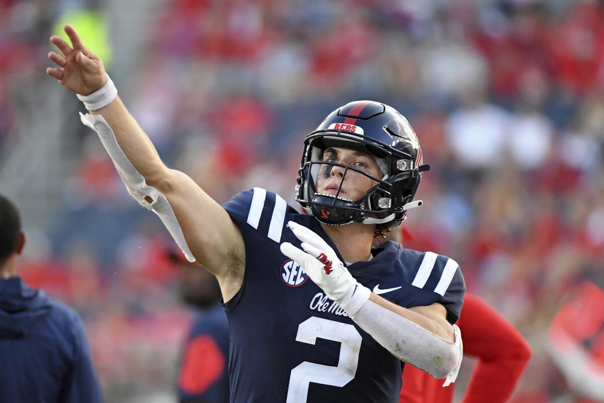 Mississippi quarterback Jaxson Dart warms up on the sidelines during a win over Tulsa on Sept. 24.