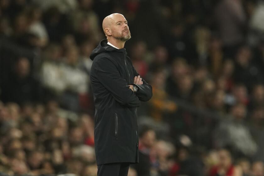 Manchester United's head coach Erik ten Hag gestures during the English League Cup third round soccer match between Manchester United and Crystal Palace at Old Trafford stadium in Manchester, England, Tuesday, Sept. 26, 2023. (AP Photo/Dave Thompson)