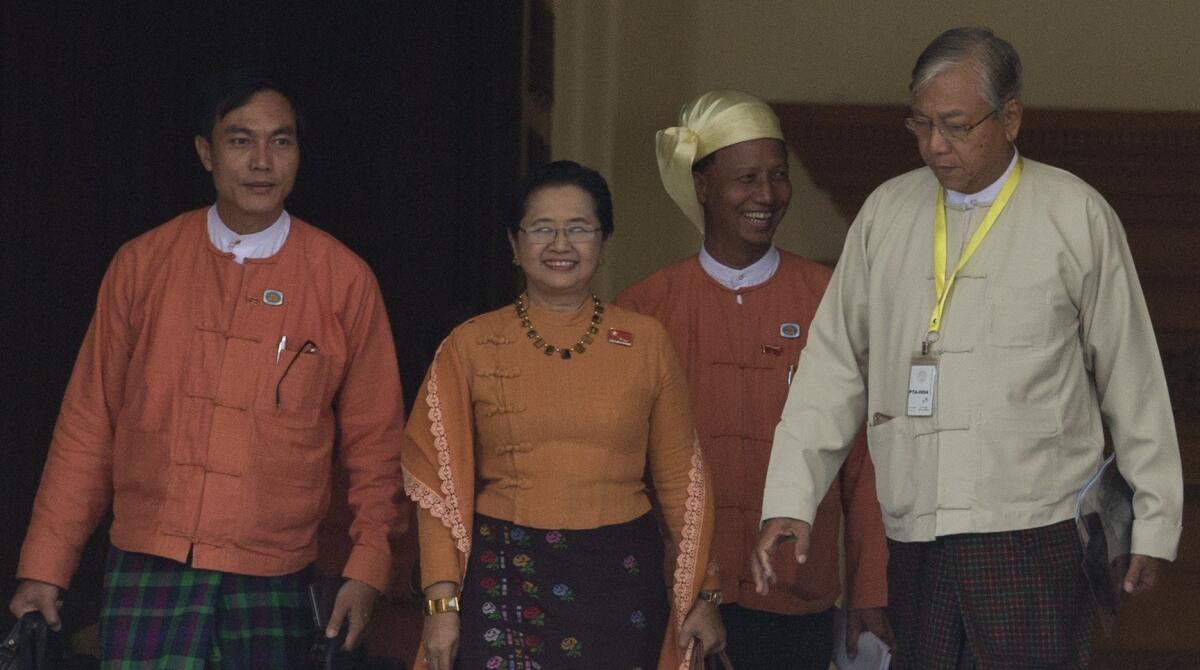 Htin Kyaw, right, the newly elected president of Myanmar, and his wife, lawmaker Su Su Lwin, leave the parliament building in Naypyitaw on March 15.