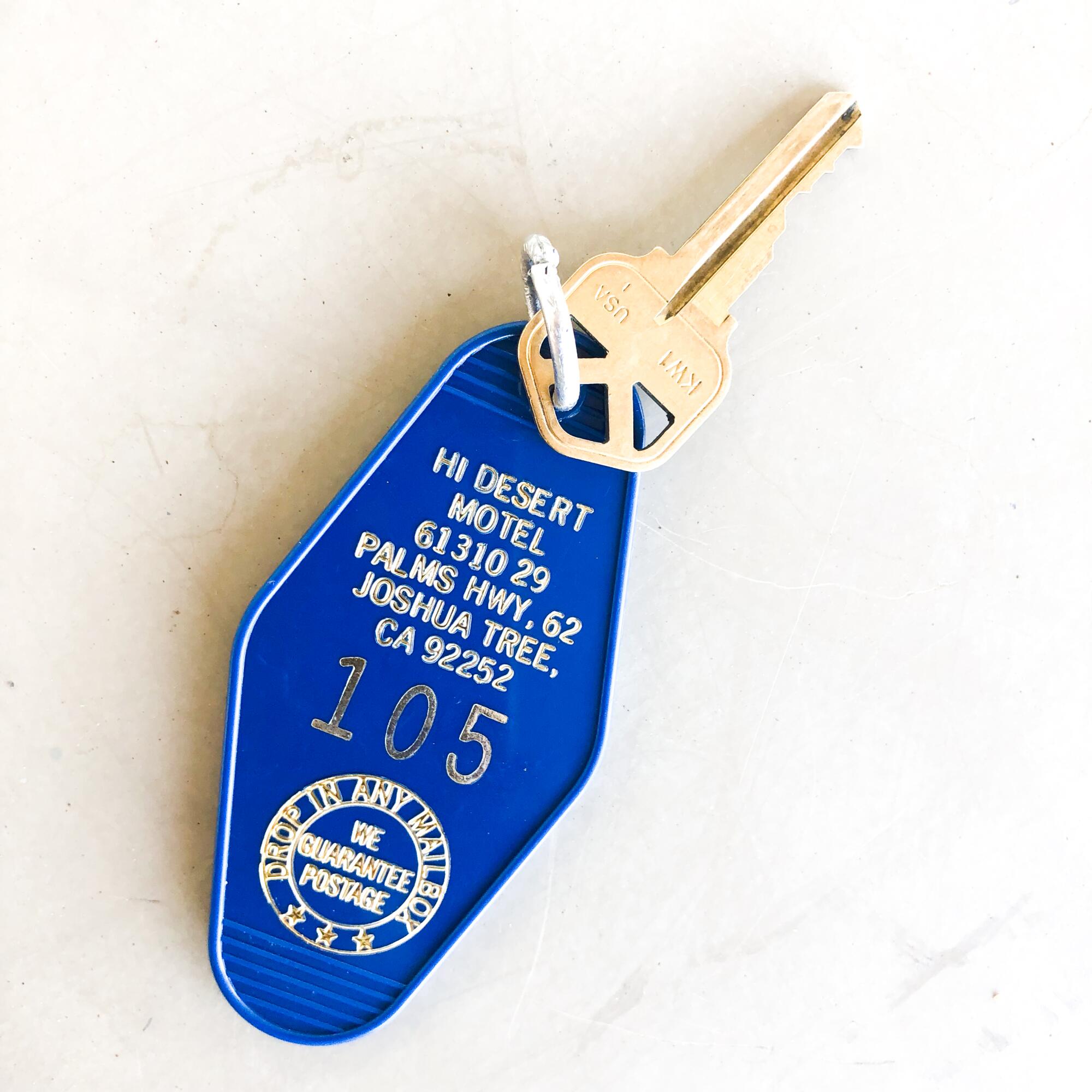 A key linked to a keychain with a tag for Hi Desert Motel