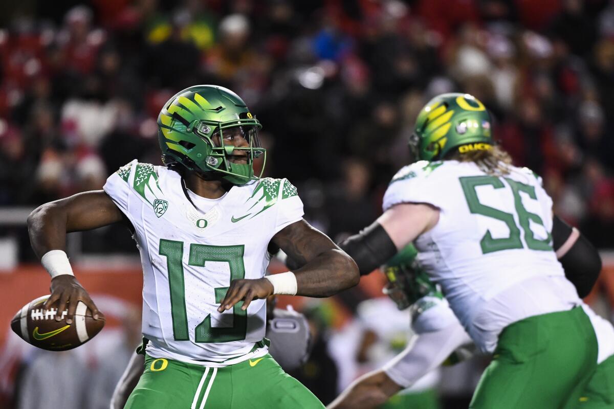 Oregon quarterback Anthony Brown looks for a pass during the first half against Utah.