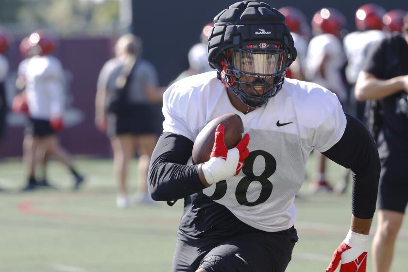 San Diego CA - March 21: San Diego State's Brandon McElroy runs a drill at practice on Thursday, March 21, 2024. (K.C. Alfred / The San Diego Union-Tribune)