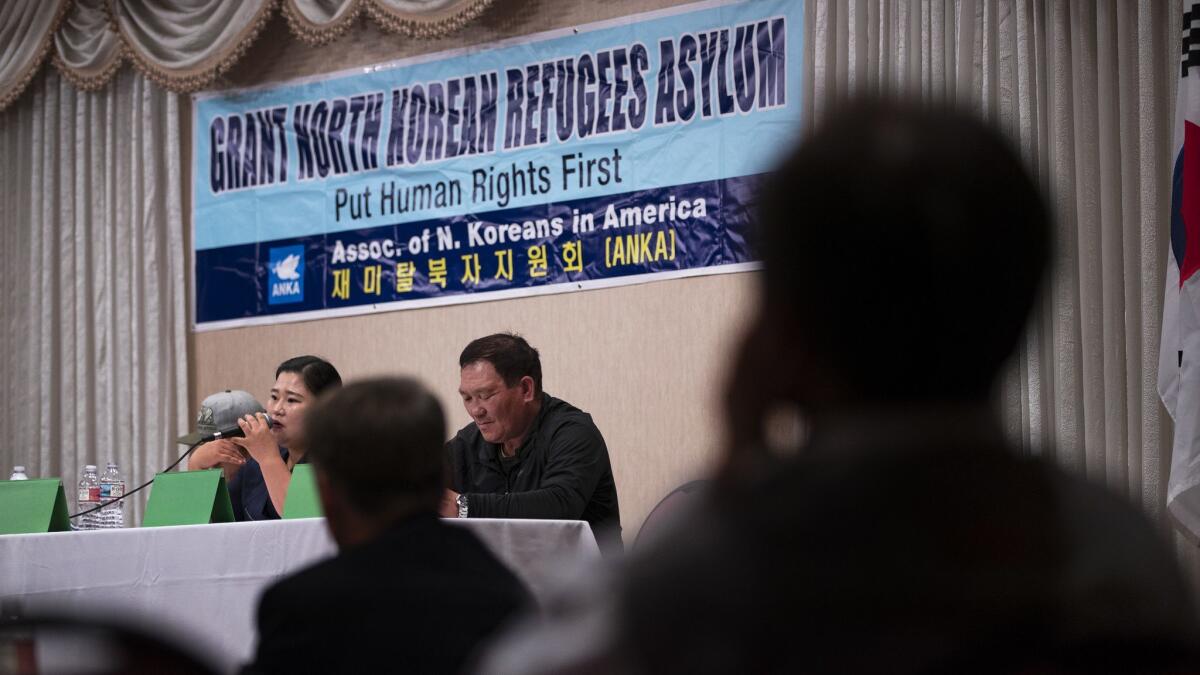 A panel of North Korean refugees gather Thursday in Koreatown to discuss the canceled U.S.-North Korean summit. Their name placards were turned around out of concern for their families in North Korea. They said they had few expectations that the summit would yield results.