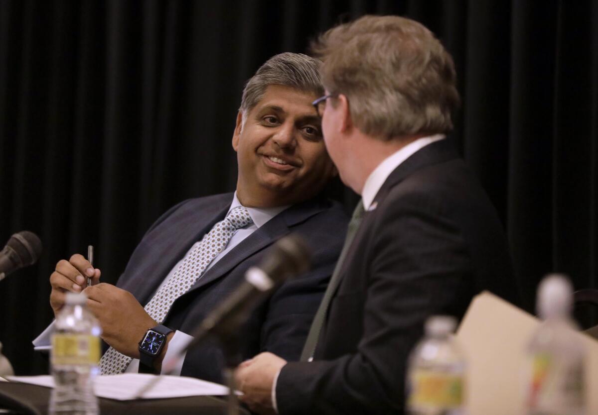 Los Angeles City Attorney candidate Faisal Gill, left, at a forum before the June primary. 