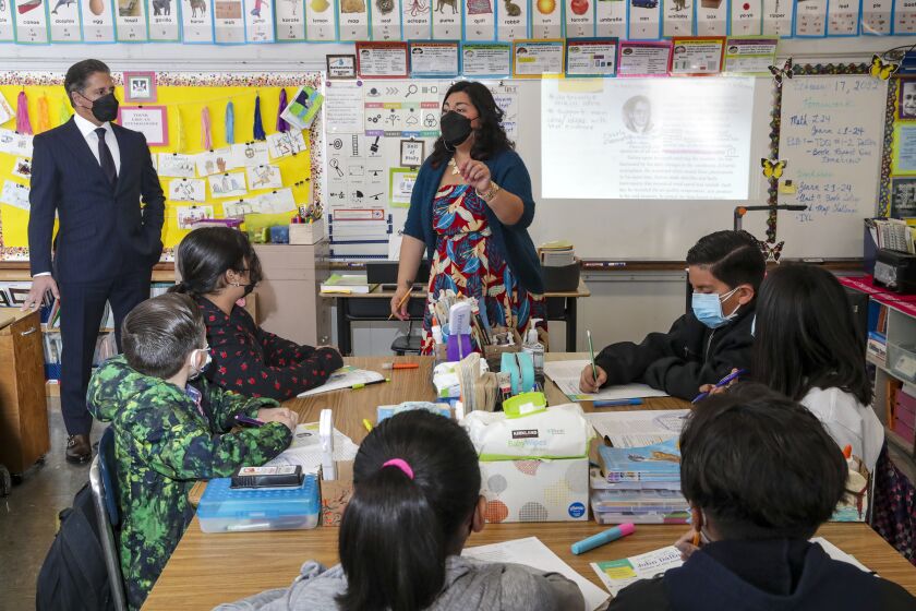 North Hollywood, CA - February 17: LAUSD new superintendent Alberto M. Carvalho, left, watches Christina Juarez teaching a 5th.Grade class at Fair Avenue Elementary School on Thursday, Feb. 17, 2022 in North Hollywood, CA. (Irfan Khan / Los Angeles Times)