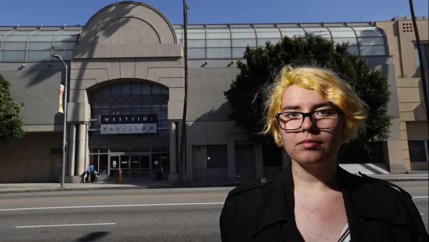 Emma Halbert is shown on Pico Boulevard, across the street from the Westside Pavilion mall. Halbert, 18, said she has shopped at the mall her entire life. The mall is set to close in 2021.