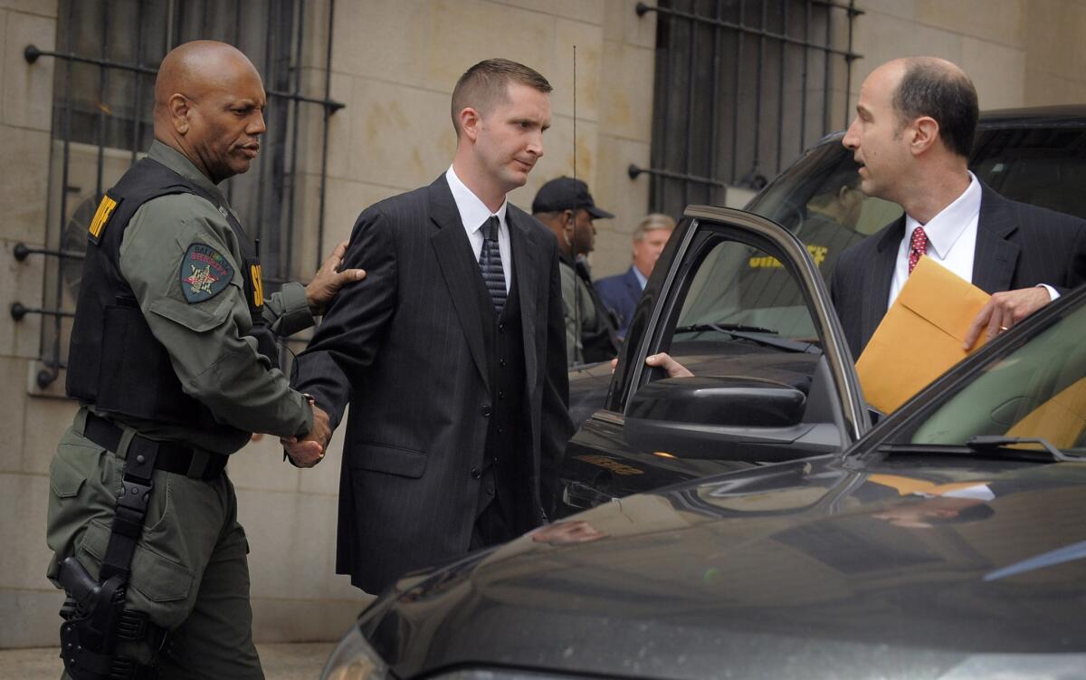 Baltimore Police Officer Edward Nero leaves the courthouse after he was acquitted of all charges.