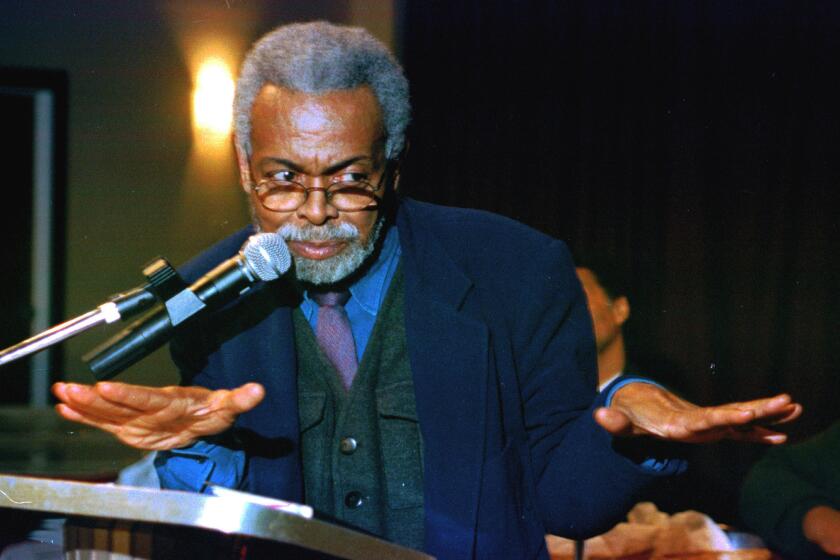 Portrait of poet Amiri Baraka speaking at the 13th annual Gwendolyn Brooks Writers' Conference in 2003.