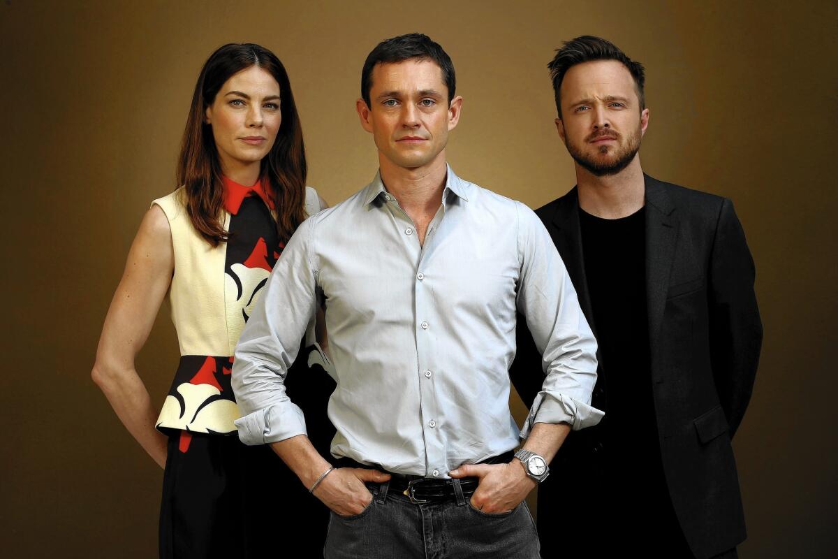 The prestige cast of “The Path”: Michelle Monaghan, Hugh Dancy, center, and Aaron Paul.